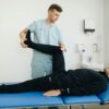 Physiotherapist helping a client